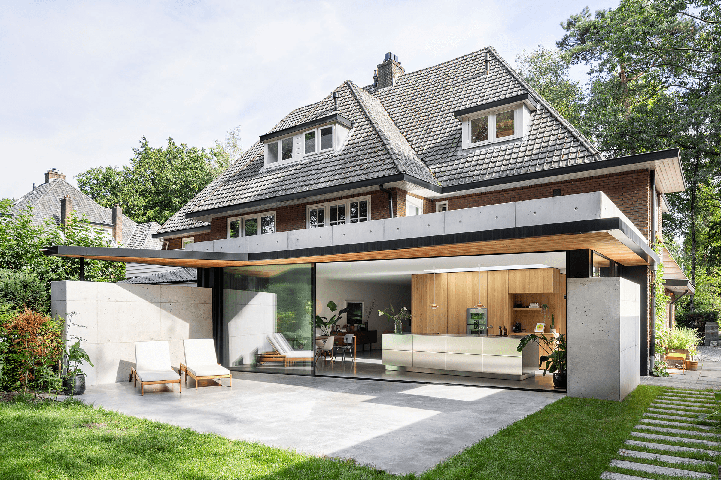 Concrete Extension with Sliding Glass Doors